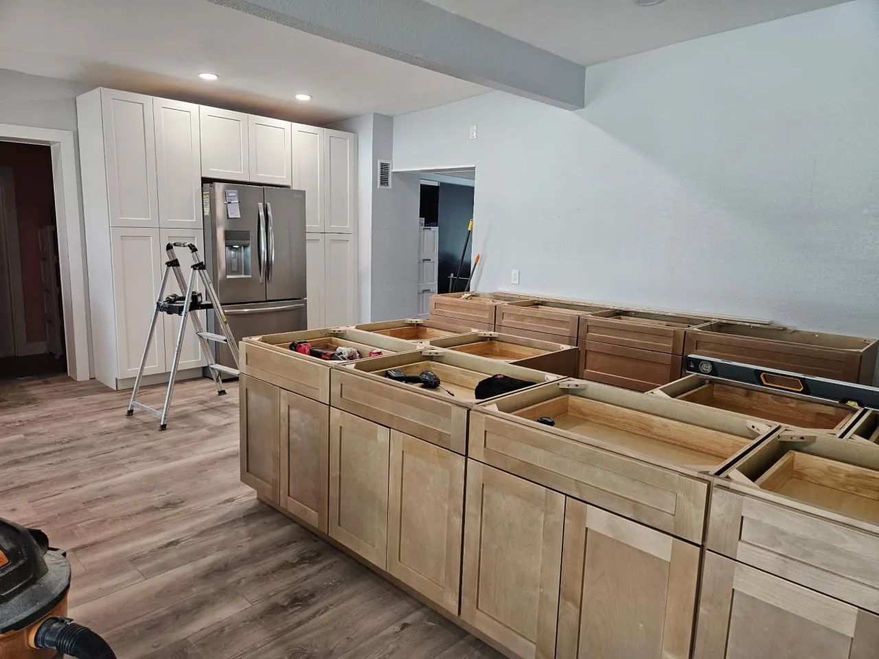 Kitchen with base cabinets installed before countertops
