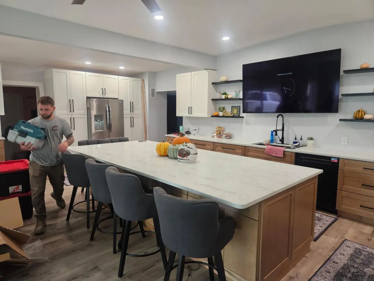 Finished kitchen with large island, white and natural wood cabinets