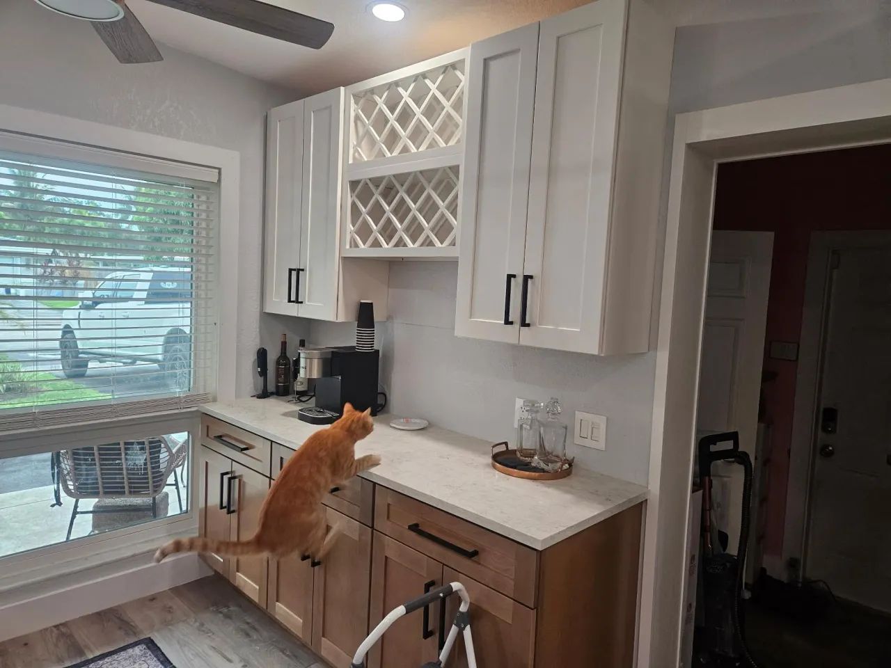 Coffee bar with wine rack and white shaker cabinets